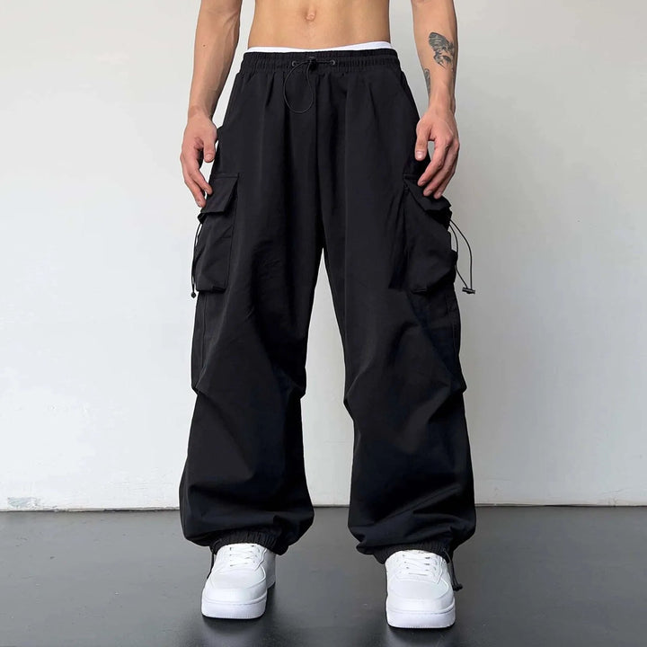 Y2K men's baggy parachute cargo pants, perfect for streetwear; offers a comfortable loose fit & multi-pockets for utility.