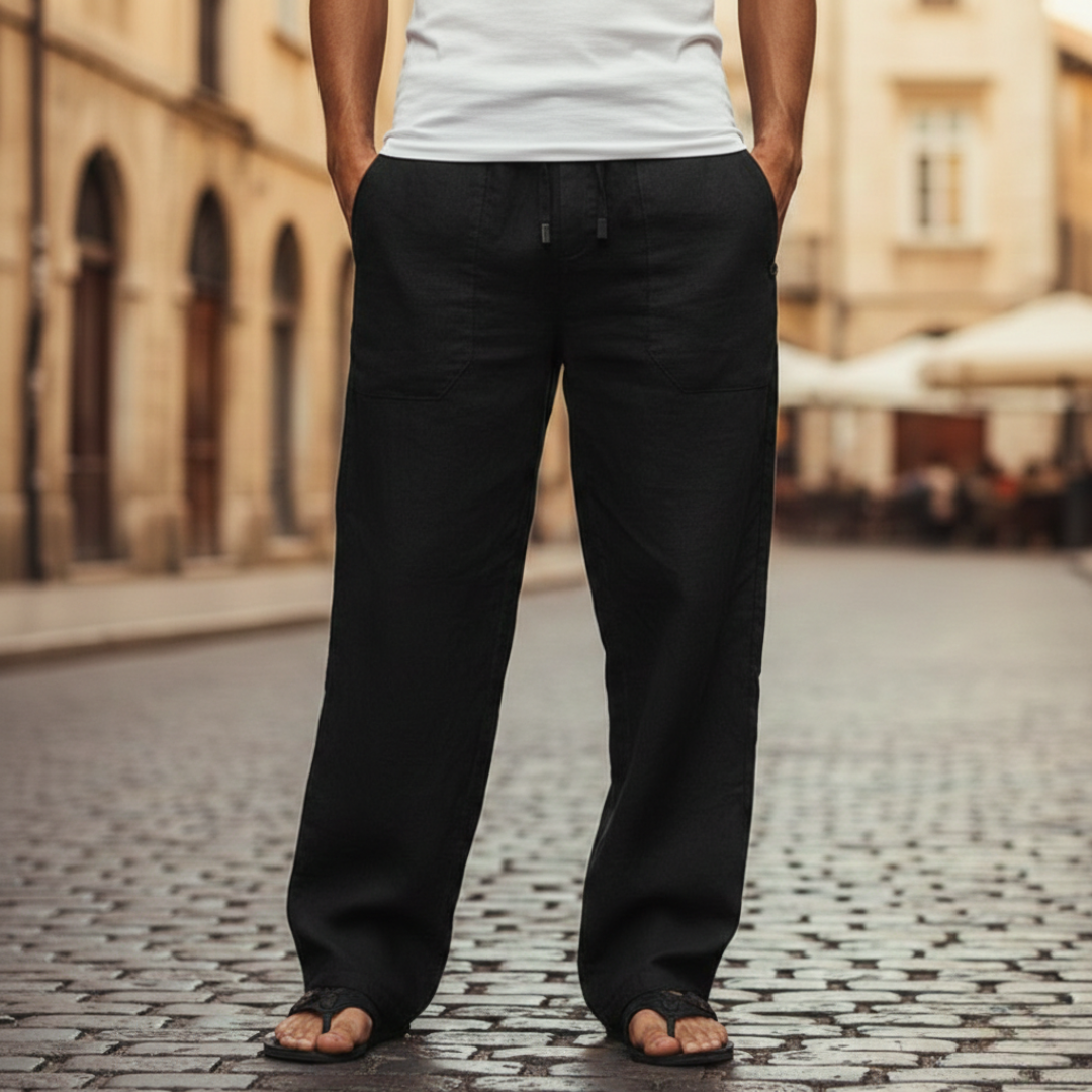 Close-up of men's baggy linen trousers, highlighting the adjustable drawstring waist and relaxed fit.