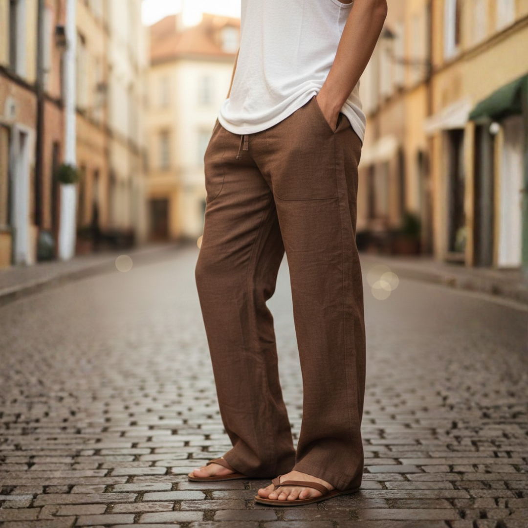 Textured men's baggy linen trousers, emphasizing the breathable fabric for cool summer comfort.