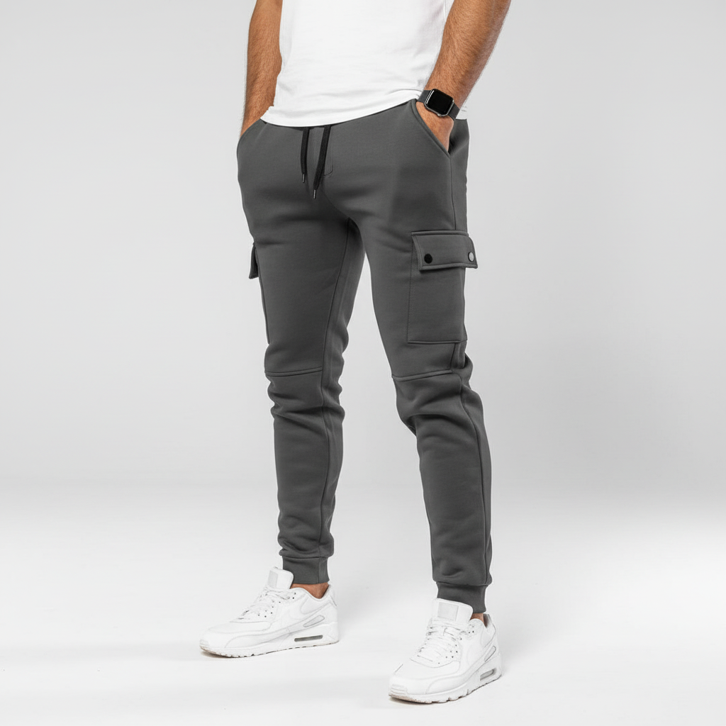 Stylish grey men's cropped joggers featuring a practical pocket, perfect for urban activewear comfort.