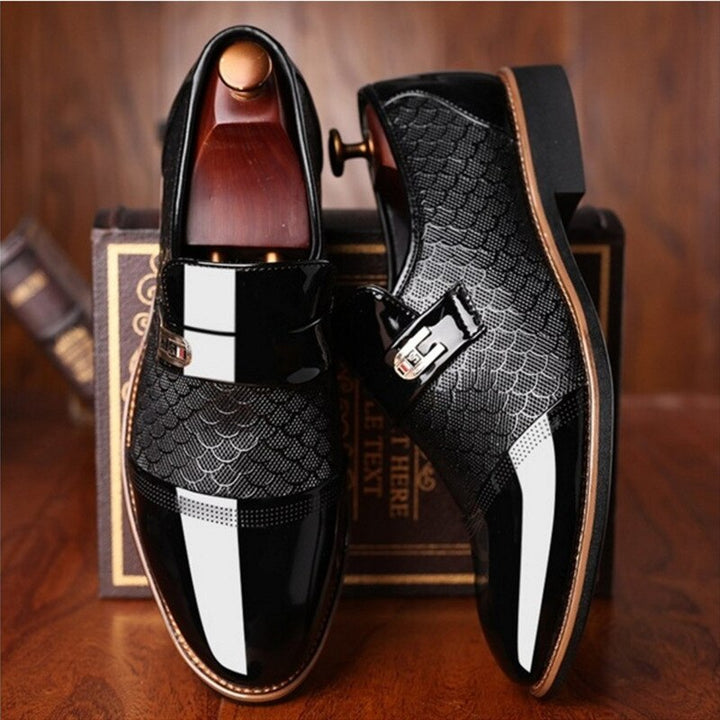 Men's black patent leather dress shoes with a sleek buckle. Ideal formal footwear for business meetings, weddings, or parties.