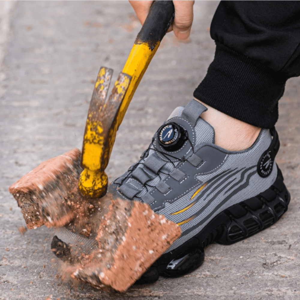Slip-resistant sole on men's black safety work shoes. Shock-absorbing design ensures all-day comfort and protection.