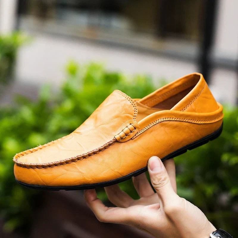 Close-up of men's blue slip-on loafers, premium comfort footwear for effortless style & all-day wear.
