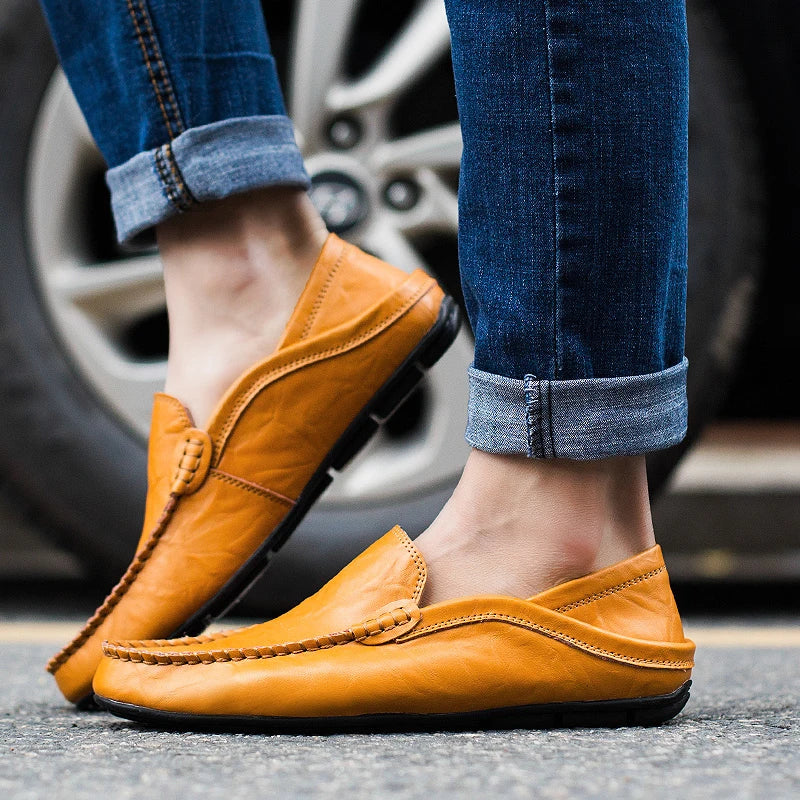 Men's black casual slip-on loafers, versatile comfort footwear for dress or everyday style.