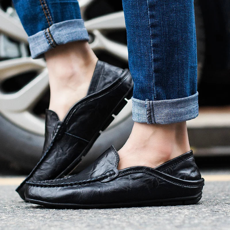 Sleek men's blue slip-on loafers, combining effortless style with all-day comfort for smart casual looks.