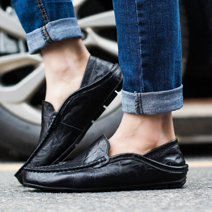 Sleek men's blue slip-on loafers, combining effortless style with all-day comfort for smart casual looks.