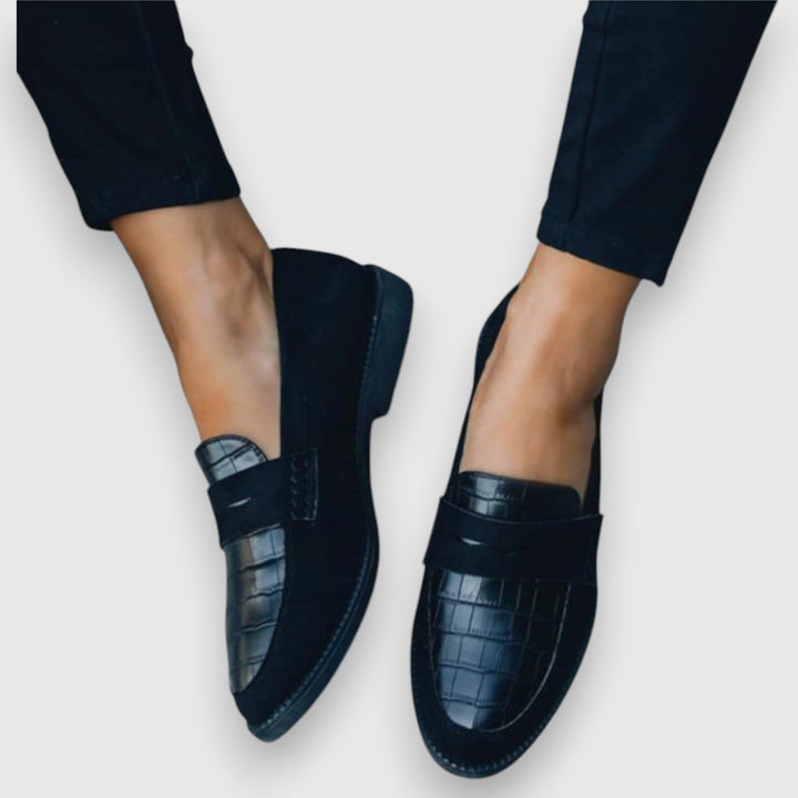 Men's black slip-on loafers for ergonomic all-day comfort, ideal for business casual and everyday wear.
