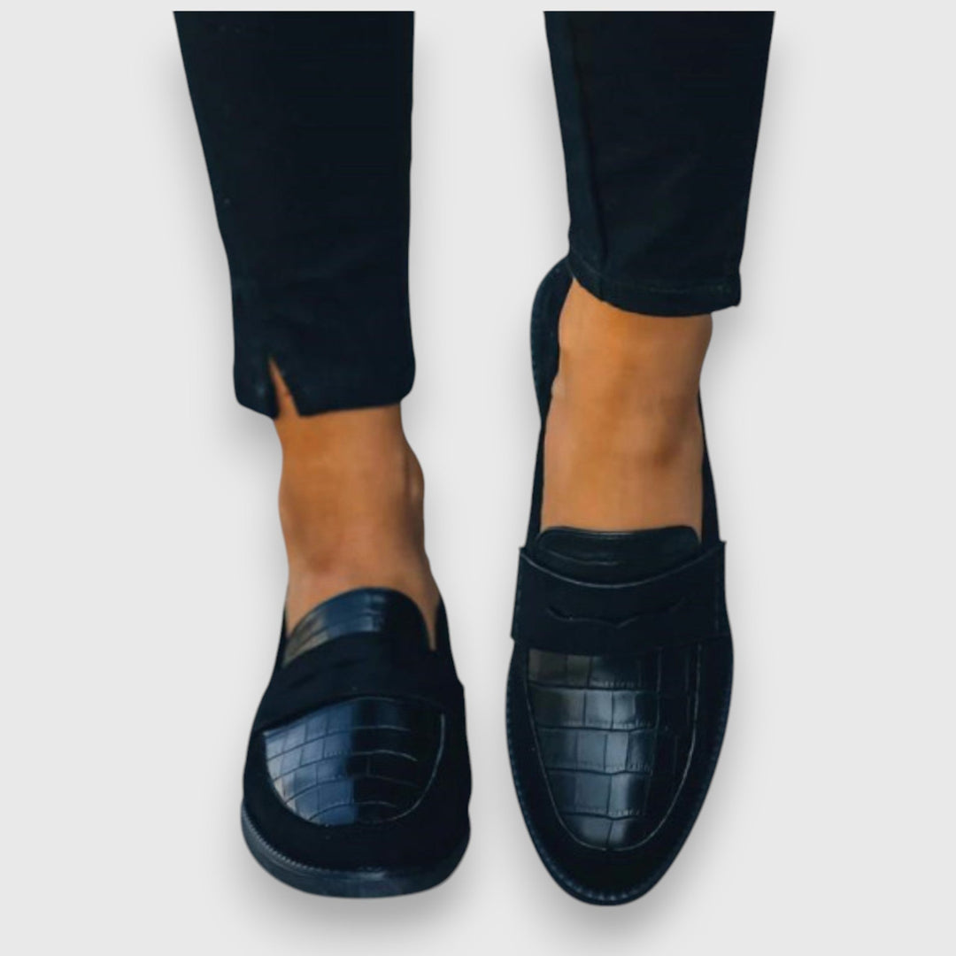 Classic men's black slip-on loafers, offering versatile style for business casual or polished everyday looks.