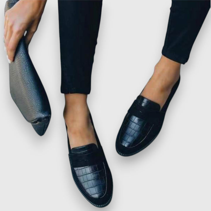 Black men's slip-on dress loafers, combining comfort with a classic design for versatile business casual style.