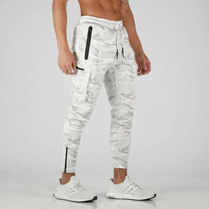 Stylish men's athletic joggers. Grey tapered fit trousers with pockets, perfect for casual wear & gym.