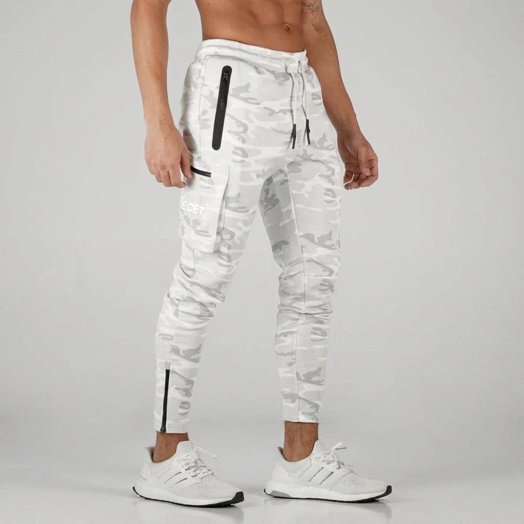 Men's sporty jogging trousers, tapered fit, ideal for running, gym, or casual wear. Features practical pockets.