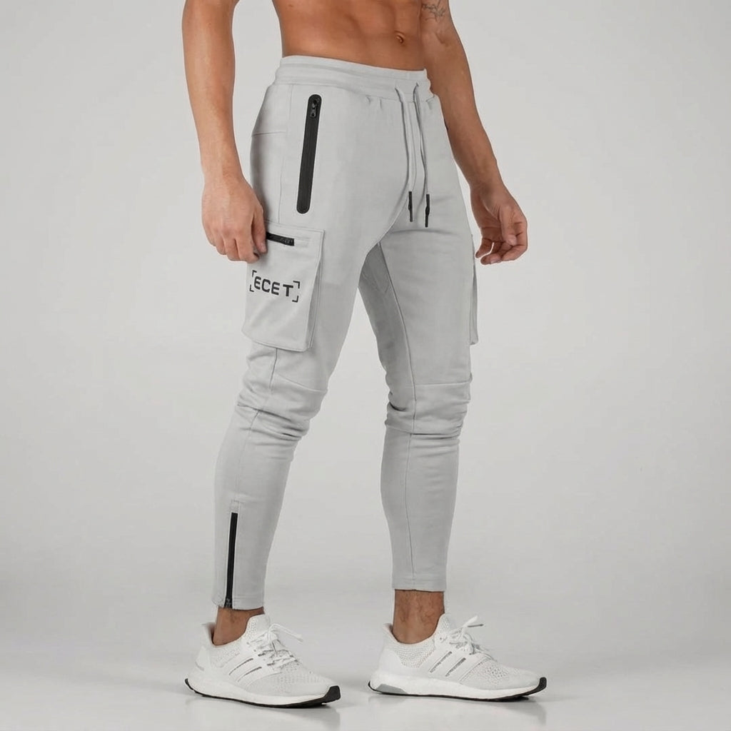 Versatile men's athletic jogging pants with secure zipper pockets. Tapered fit for gym, running, or casual wear.