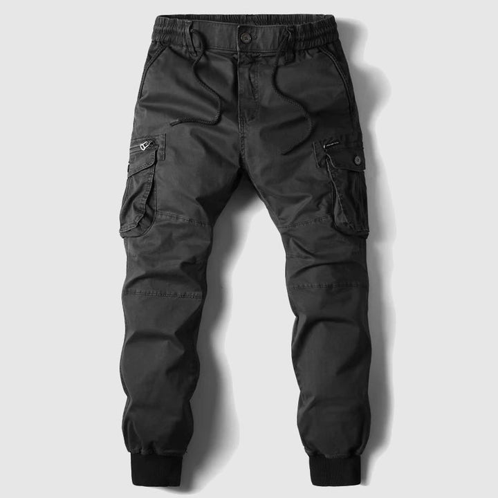 Relaxed fit men's utility cargo joggers in durable fabric, ensuring ultimate comfort and freedom of movement.