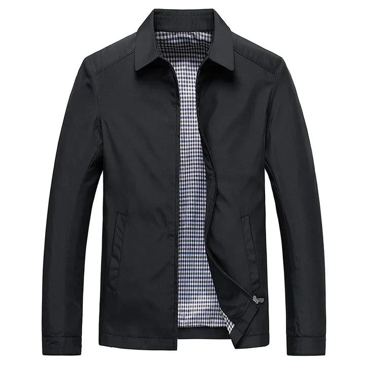 Men's black zip-up jacket with stylish checked lining. Perfect smart casual outerwear.