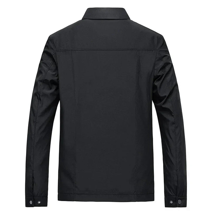 Versatile men's black jacket. Features a full zip-up front and classic checked inner lining.
