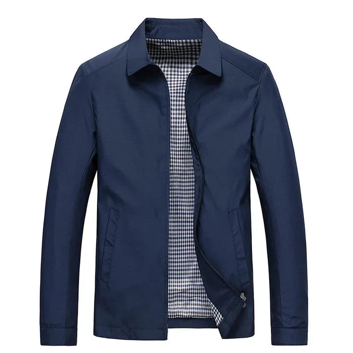 Stylish men's black travel jacket, a versatile zip-up with a subtle, fashionable checked lining.