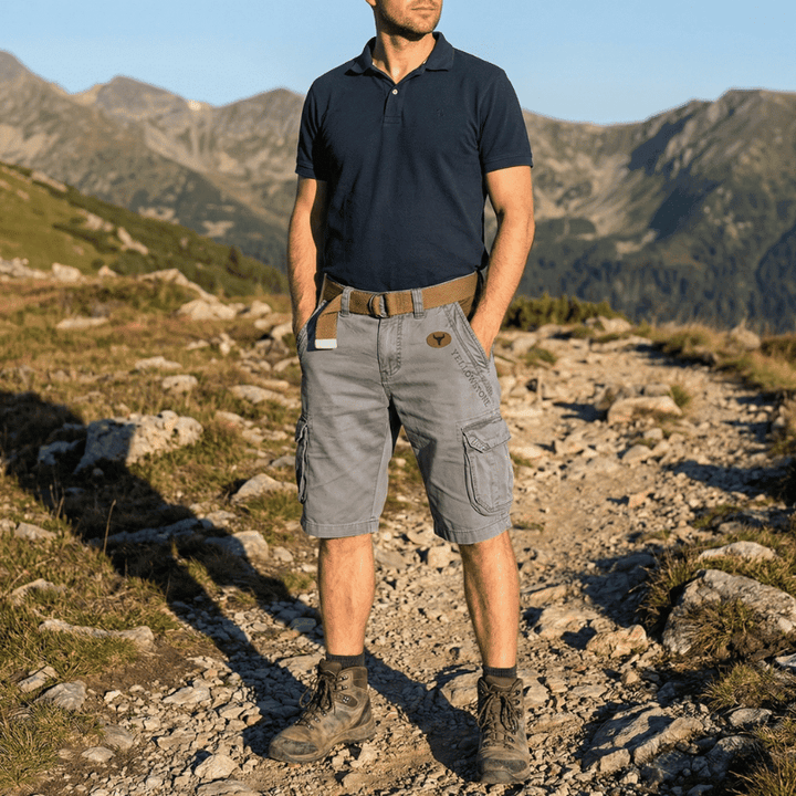Comfortable men's cargo shorts with multiple utility pockets & breathable fabric, ideal for summer activities.