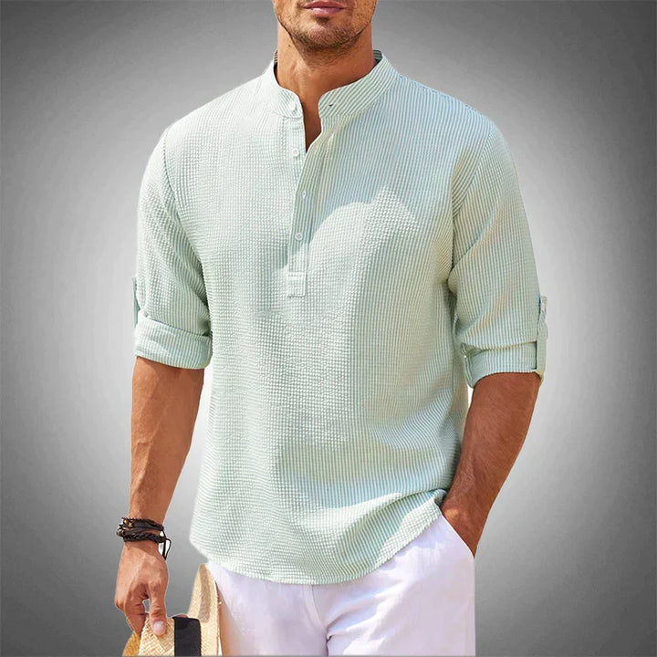 Man in a breathable short sleeve summer shirt, enjoying a warm day. Perfect casual comfort for vacation & leisure.