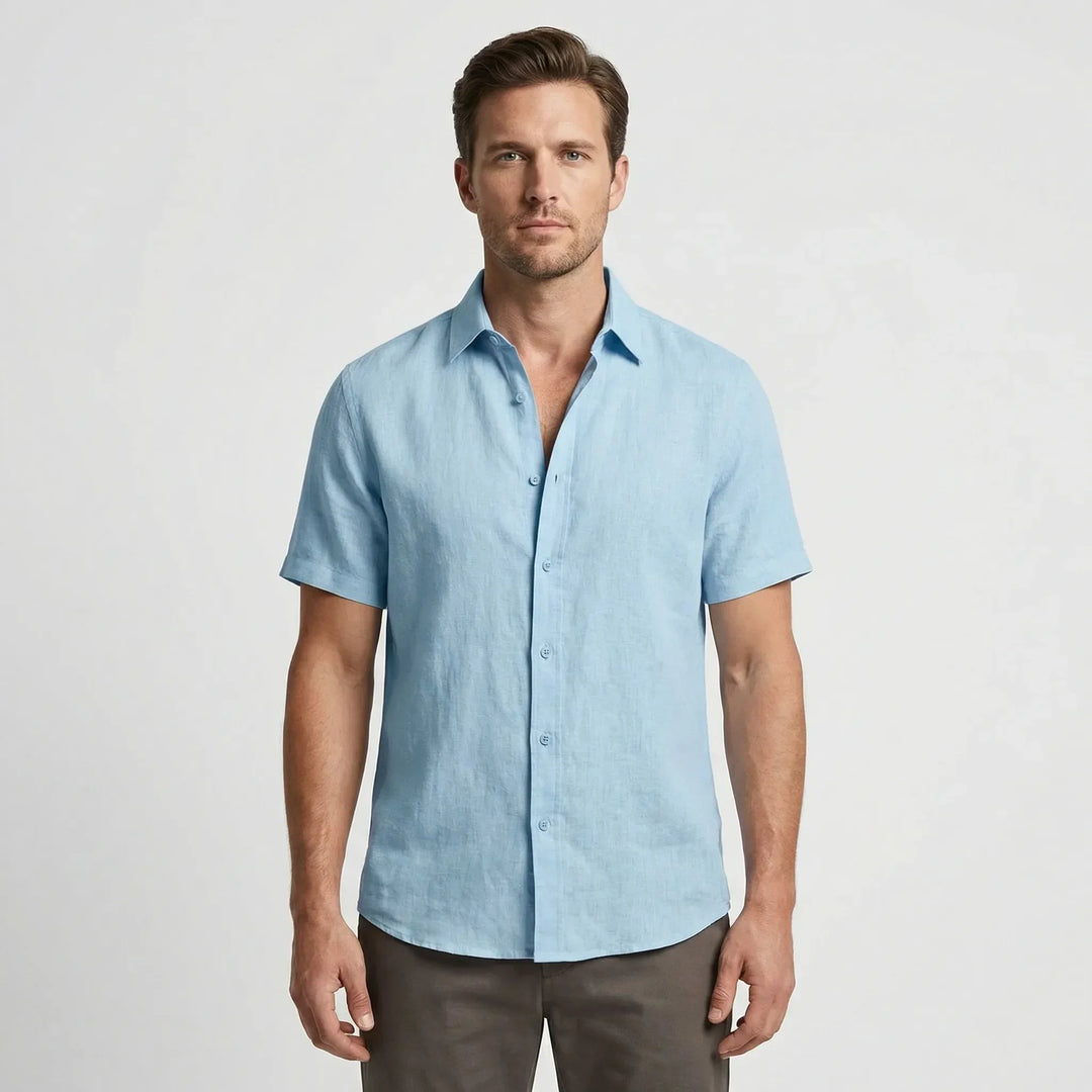 Relaxed fit men's casual button-up shirt, breathable fabric for warm-weather adventures.