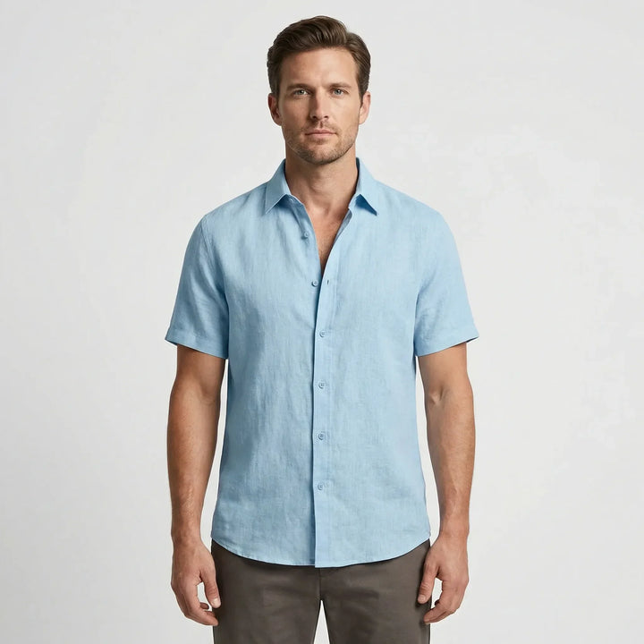 Relaxed fit men's casual button-up shirt, breathable fabric for warm-weather adventures.
