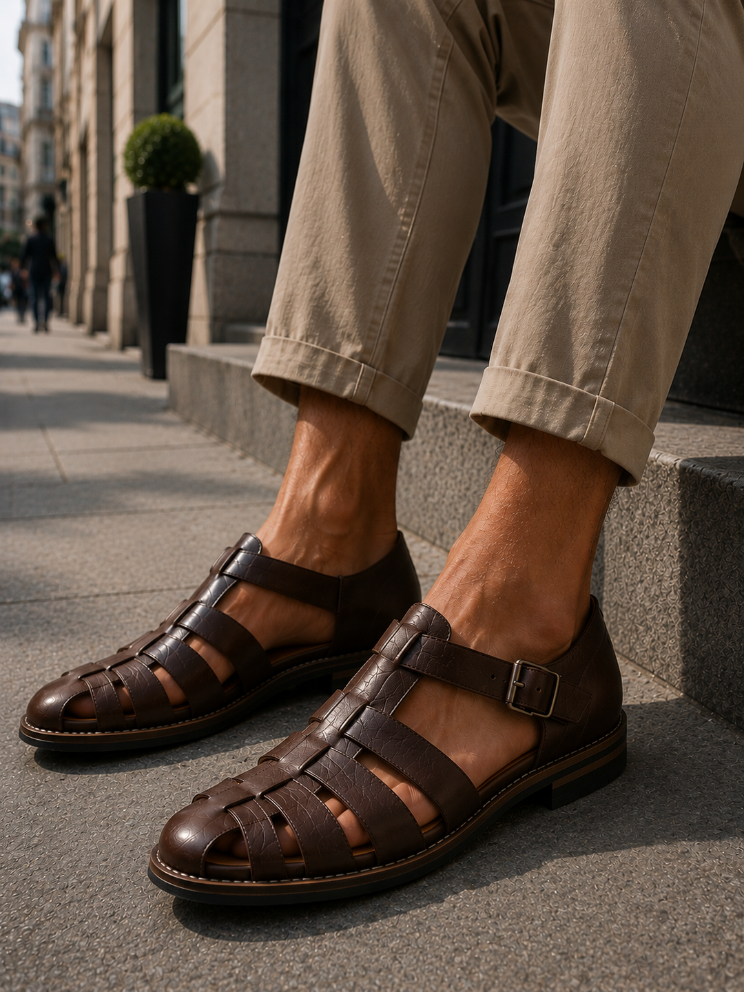 Classic men's closed-toe fisherman sandals in brown, featuring woven leather design and sturdy buckle for summer.