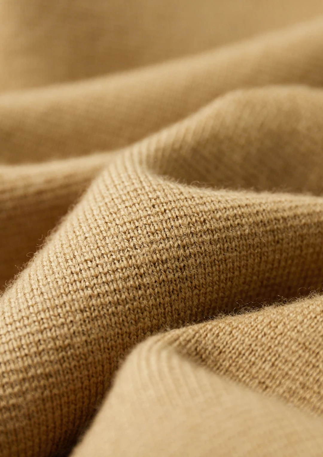 Men's button-up cardigan with functional patch pockets. A stylish long-sleeve layer for fall & winter men's fashion.