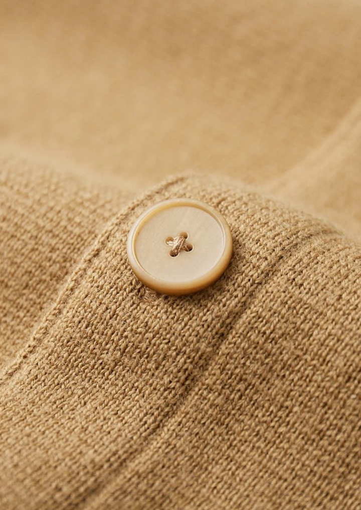 Refined men's button-up cardigan with patch pockets. A comfortable, smart casual long-sleeve knit for everyday style.