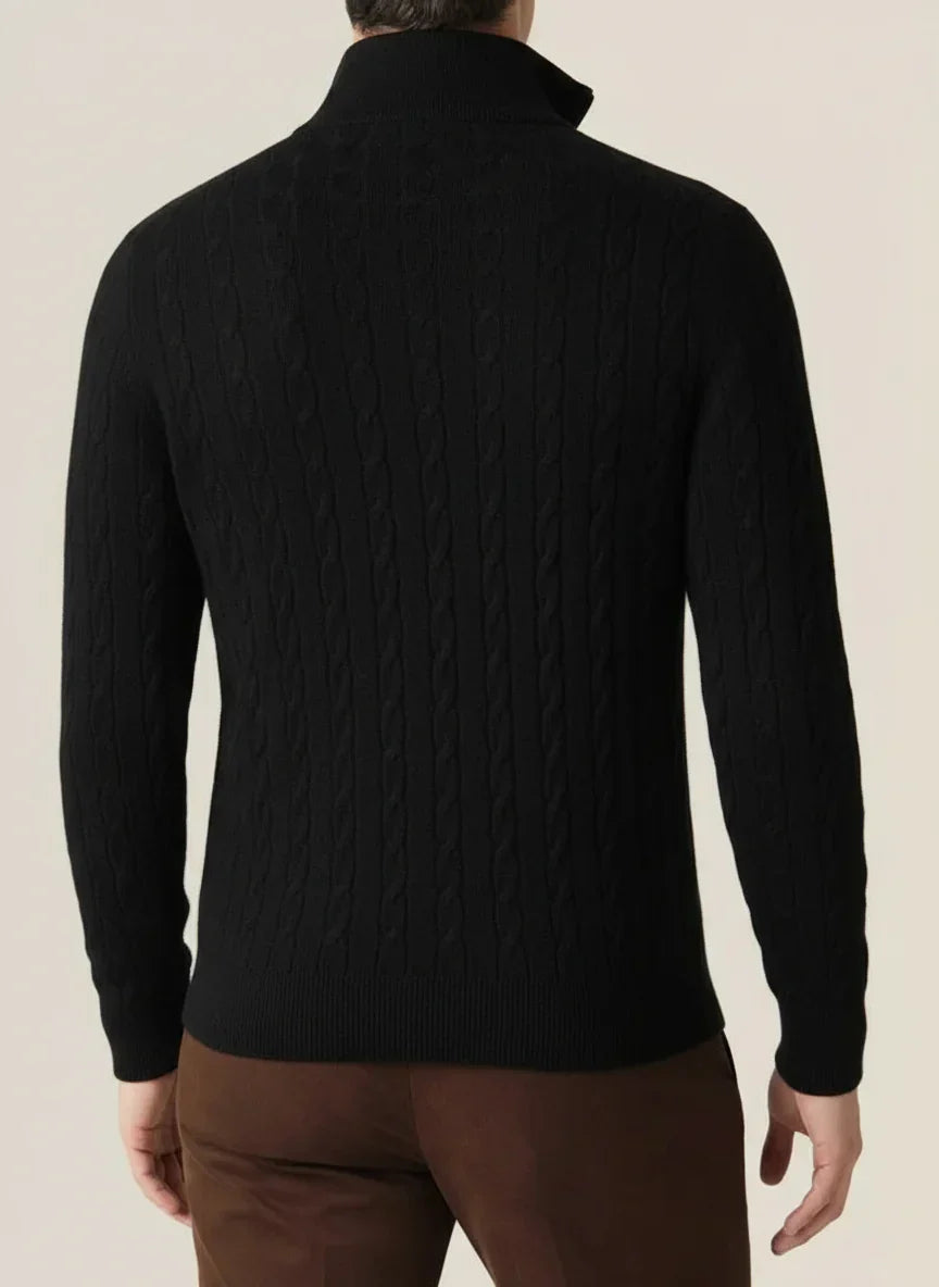 Close-up of the intricate cable knit pattern on a comfortable men's half-zip pullover jumper.