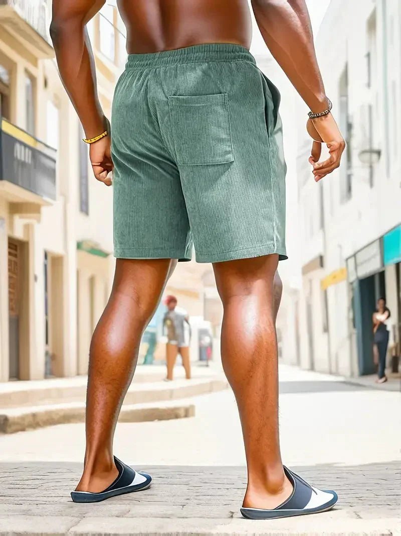 Men's casual beach shorts with drawstring, relaxed fit, ideal for seaside relaxation.