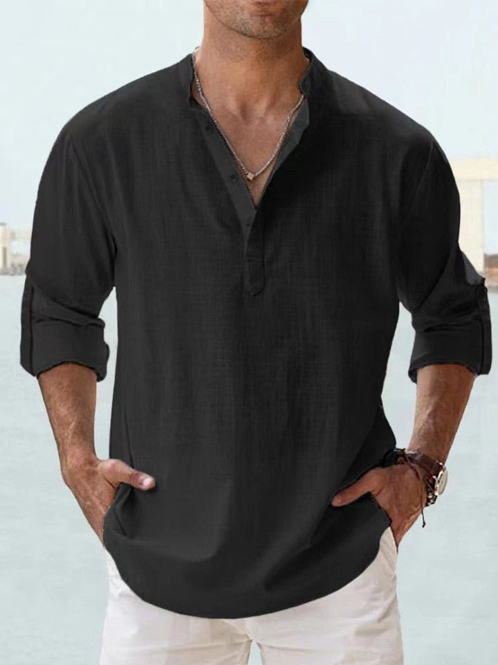Stylish men's henley top featuring a modern mandarin collar & long sleeves, perfect for summer.