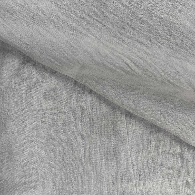 Detailed view of a men's summer short sleeve button-up shirt, highlighting the buttons and fabric texture.