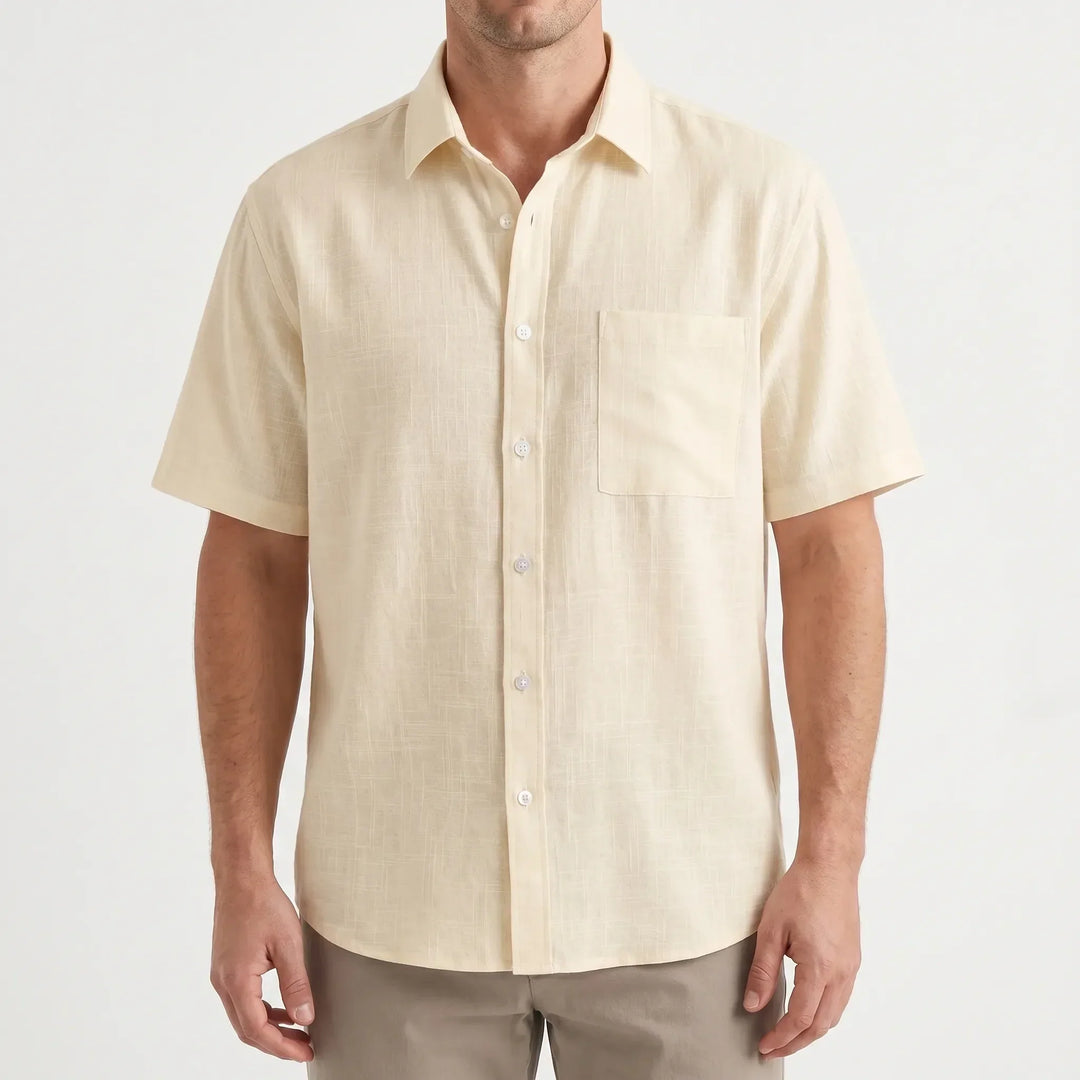 Classic men's short-sleeve button-up shirt in a solid color. Versatile for casual outings & summer style.