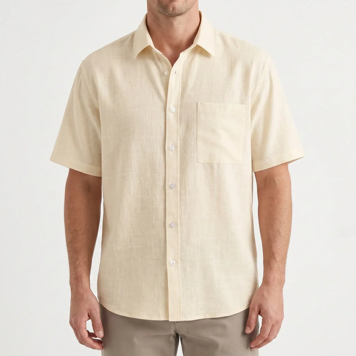 Classic men's short-sleeve button-up shirt in a solid color. Versatile for casual outings & summer style.
