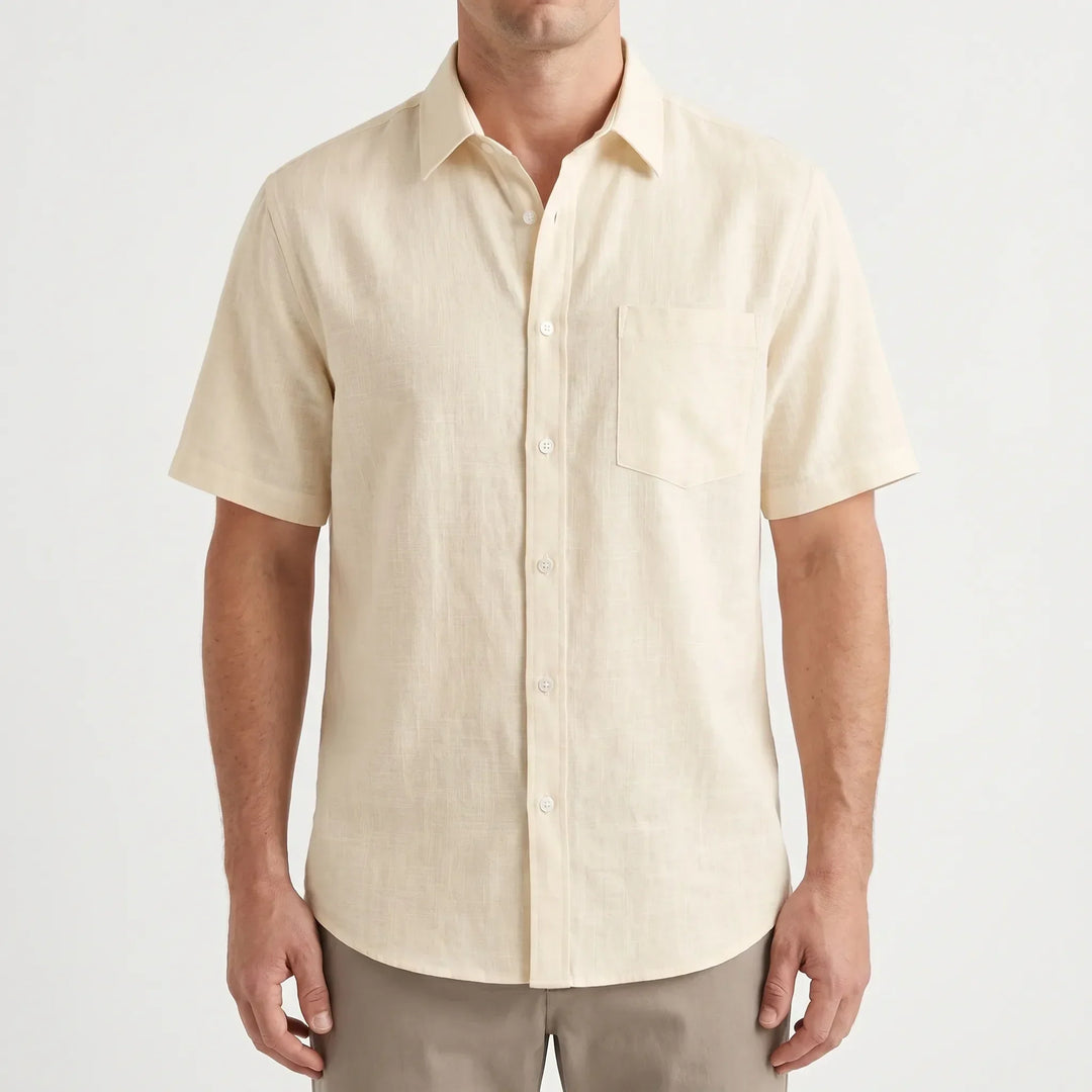 Close-up of a men's casual short-sleeve button-up shirt, showing solid color fabric. Ideal for warm weather.
