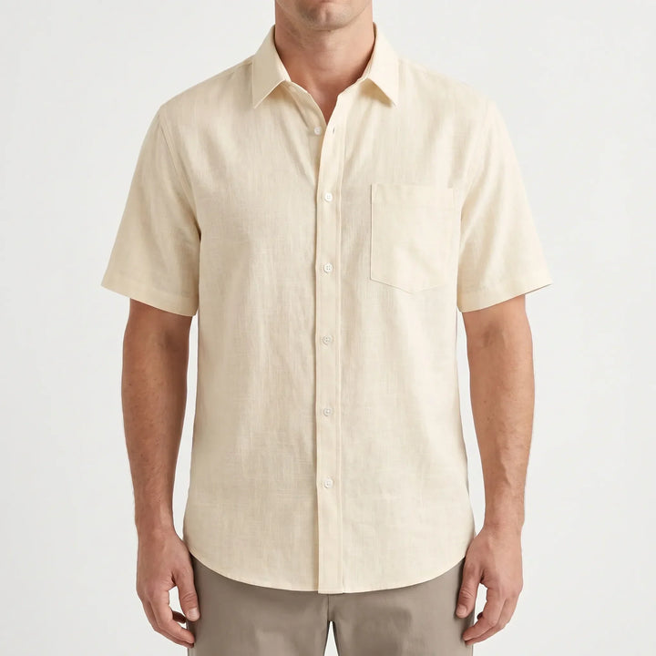 Close-up of a men's casual short-sleeve button-up shirt, showing solid color fabric. Ideal for warm weather.