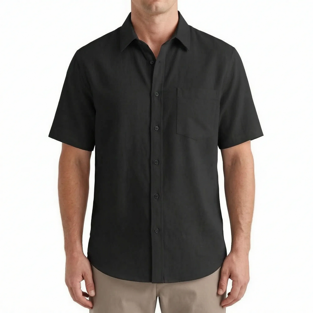 Model wearing a men's casual short-sleeve button-up shirt. Perfect apparel for relaxed summer occasions.