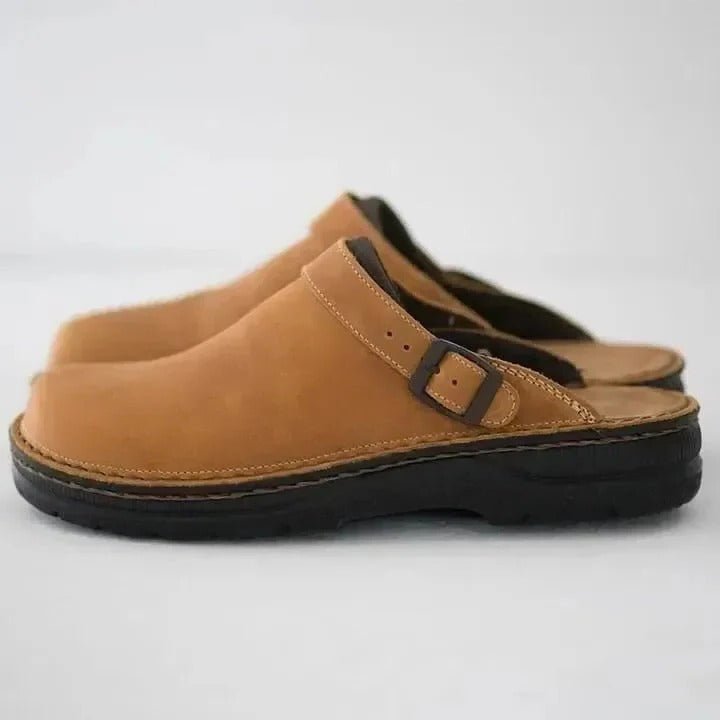 Men's slip-on casual footwear, these mules feature a supportive heel strap for comfort and versatile style.