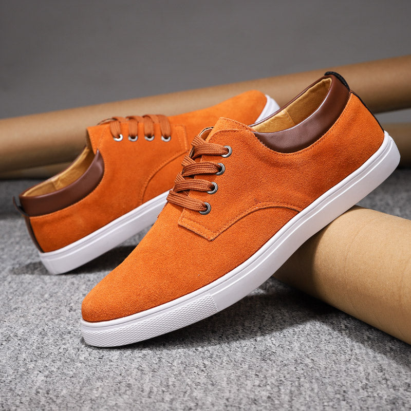 Man walking confidently in comfortable men's fashion sneakers, perfect for active everyday wear & street style.
