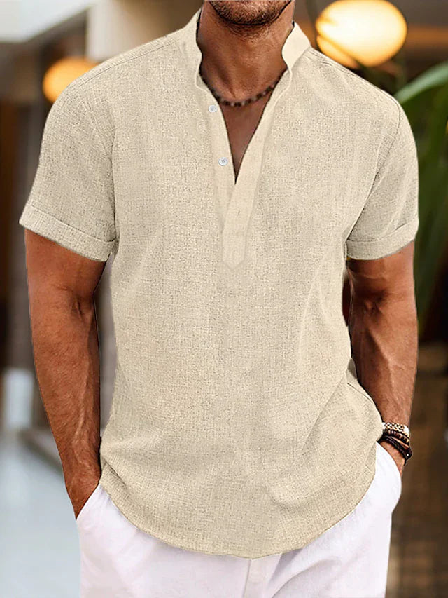 Man in a regular fit short sleeve V-neck polo shirt, showcasing comfortable men's casual everyday fashion.