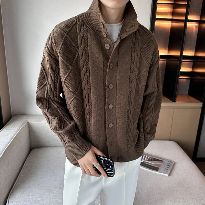Men's chunky cable knit cardigan sweater with button front, ideal for versatile layering and stylish casual wear.