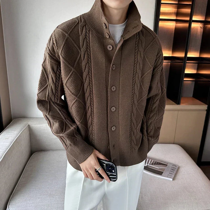 Men's chunky cable knit cardigan sweater with button front, ideal for versatile layering and stylish casual wear.