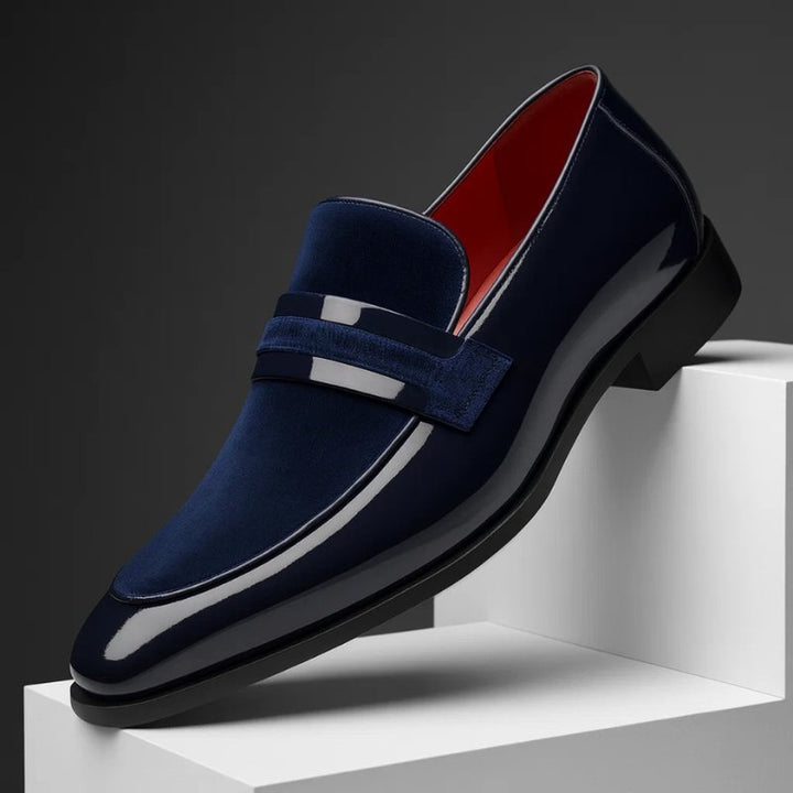 Men's classic black leather penny loafers, offering stylish comfort for everyday and formal wear.