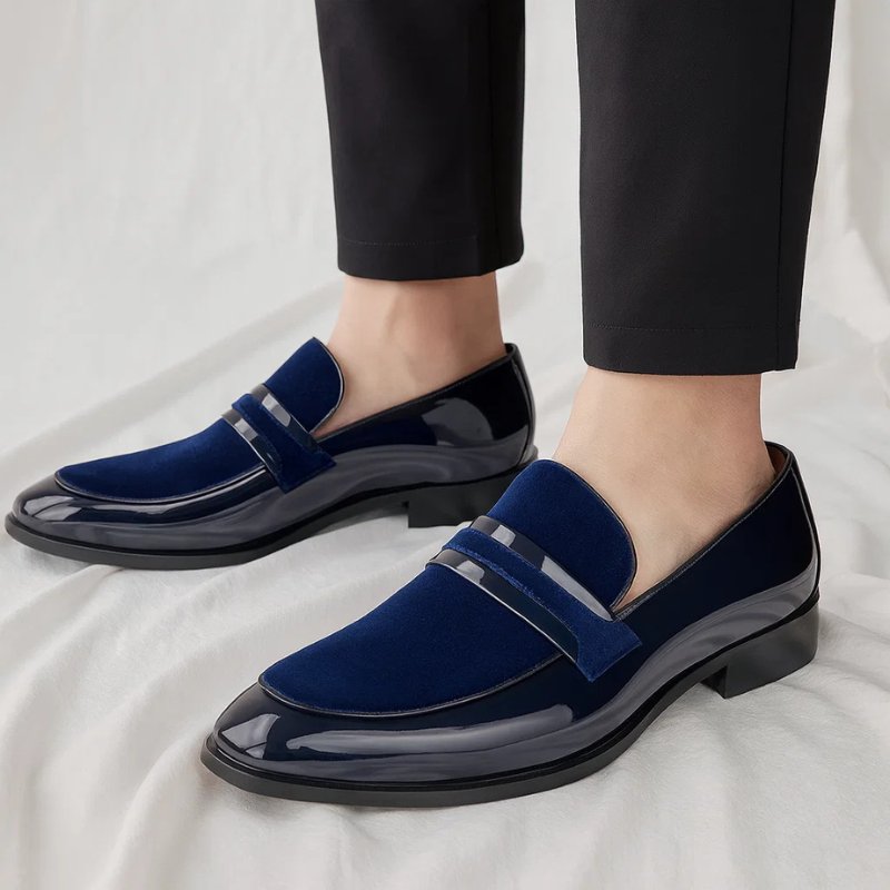 Versatile men's slip-on penny loafers in brown leather, perfect for smart casual or dressy occasions.