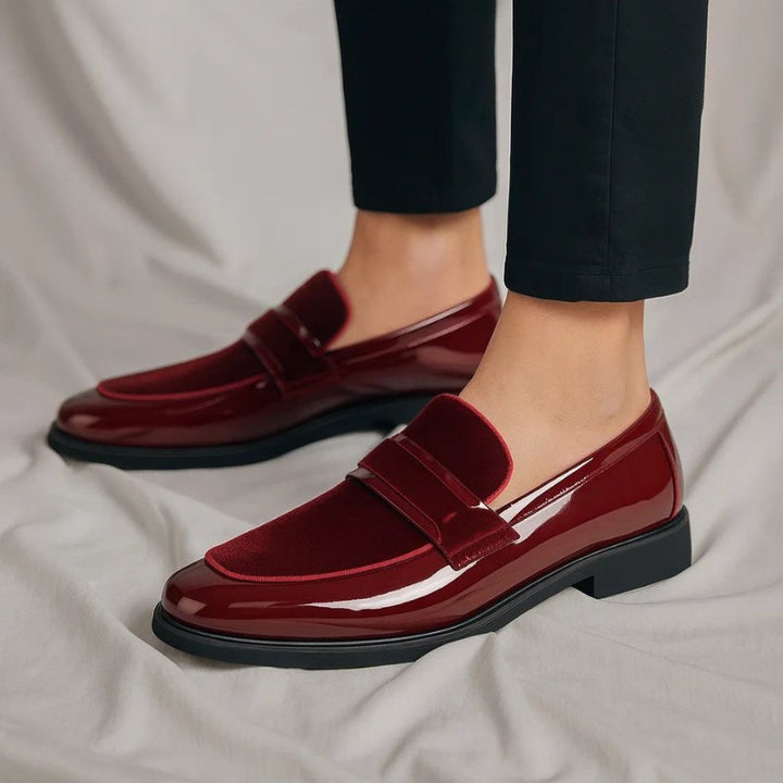 Dark brown leather penny loafers for men, combining classic style with easy slip-on comfort.