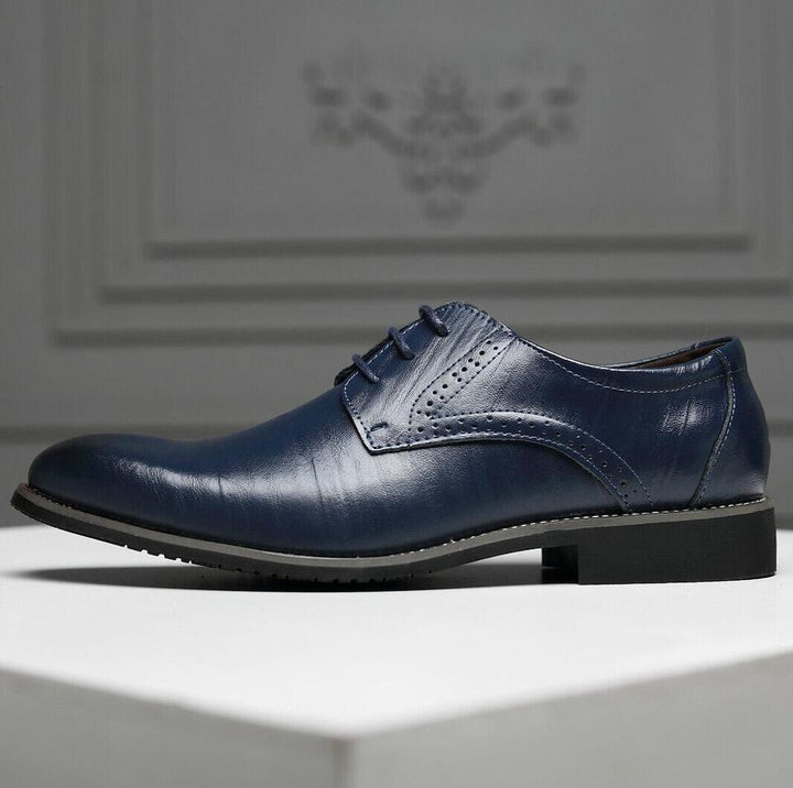 Close-up of polished Black Men's Oxford Shoes, showcasing quality leather, intricate stitching & comfortable design.