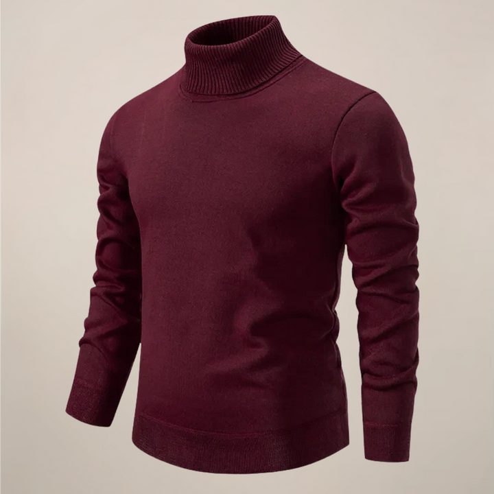 Stylish men's turtleneck sweater paired with smart casual trousers, showcasing a sleek modern fit knit for autumn.