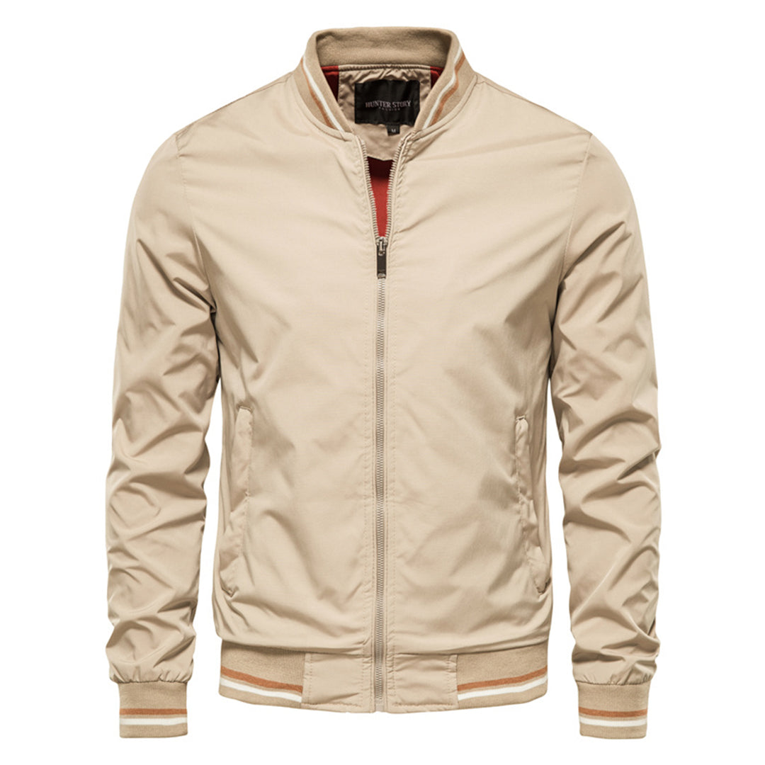Full-length shot of a men's classic bomber jacket, highlighting its timeless design and ribbed trim.