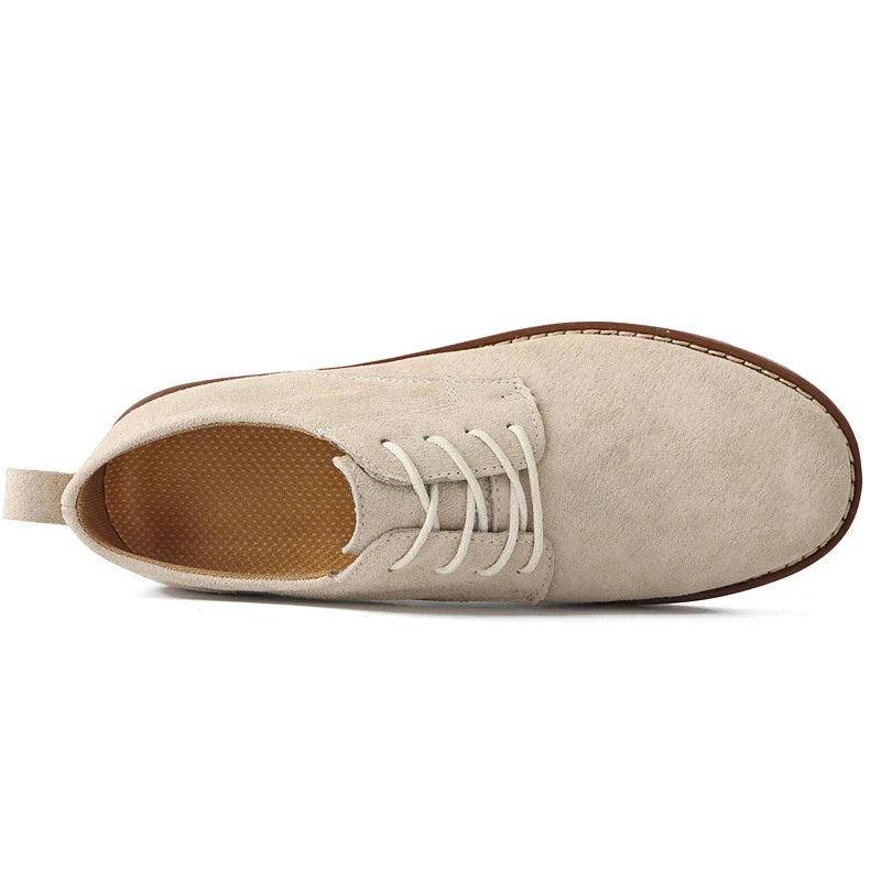 Front view: Elegant men's brown oxfords. Classic formal footwear blending timeless style with ultimate comfort.