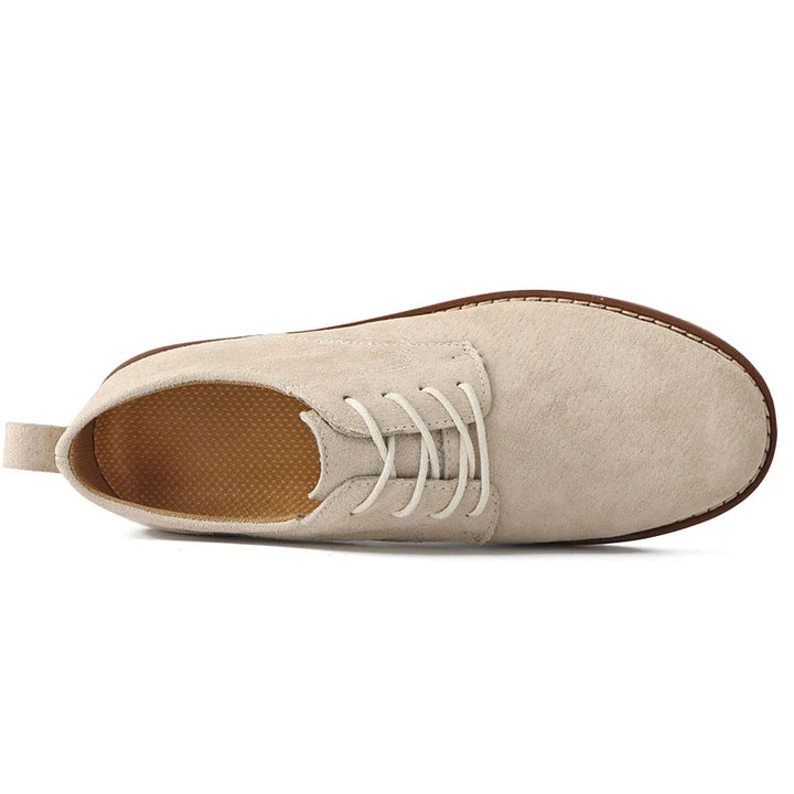 Front view: Elegant men's brown oxfords. Classic formal footwear blending timeless style with ultimate comfort.