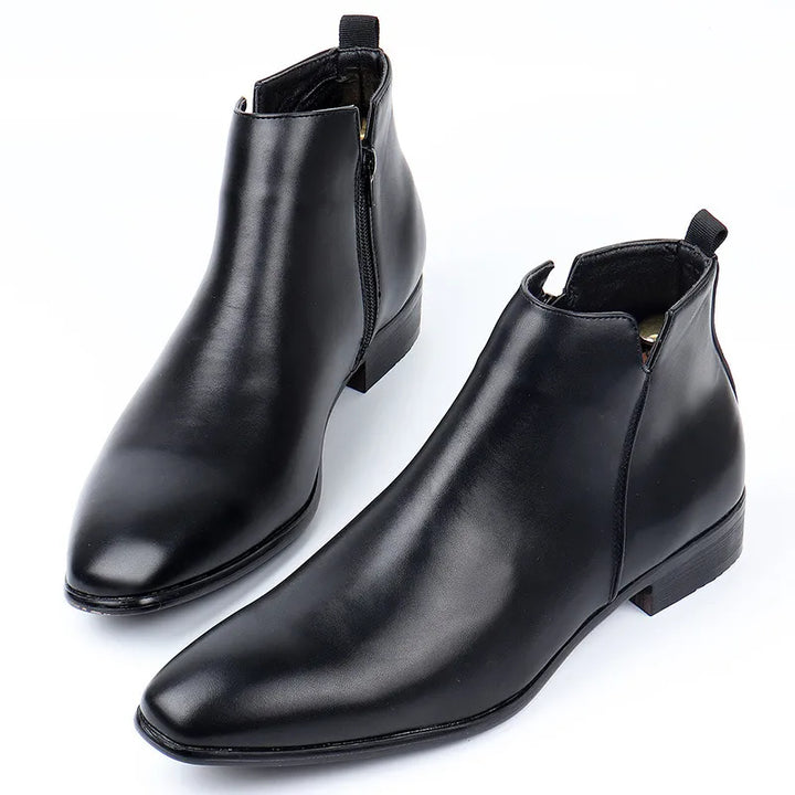 Men's classic brown leather Chelsea boots with pointed toe, offering comfort and elegant style for versatile wear.